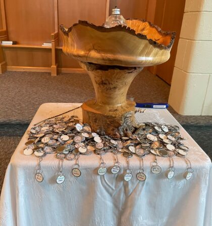 UUCV chalice with tokens on a table below